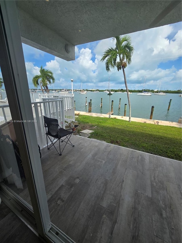 exterior space featuring a water view and a yard