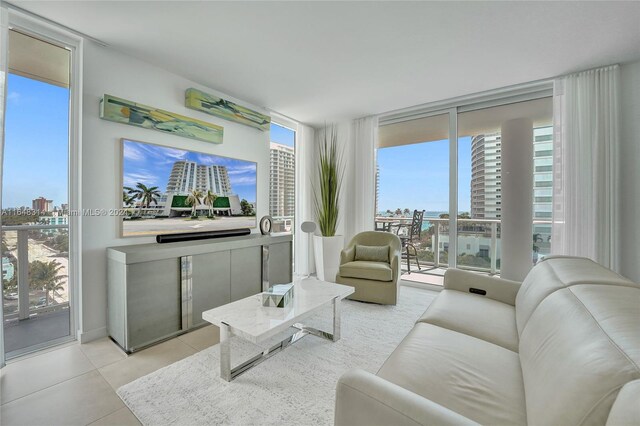 tiled living room featuring expansive windows