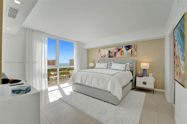 tiled bedroom featuring access to outside