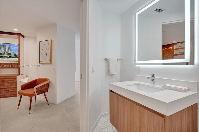 bathroom with tile patterned flooring and vanity