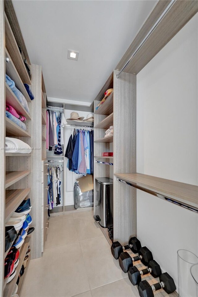 spacious closet with light tile patterned flooring