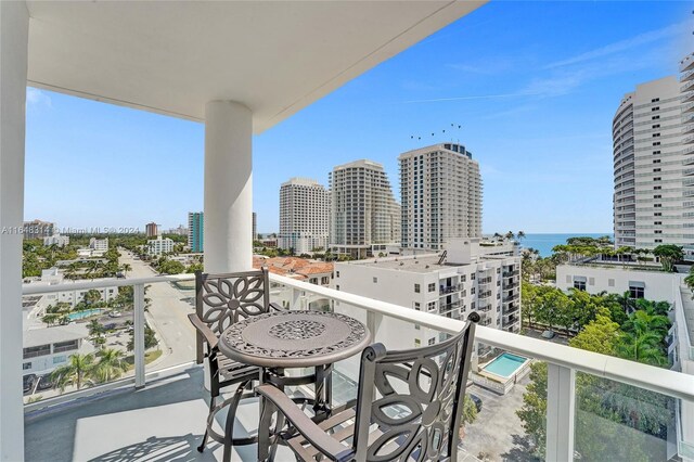 balcony featuring a water view