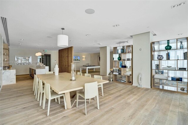 dining space featuring light wood-type flooring