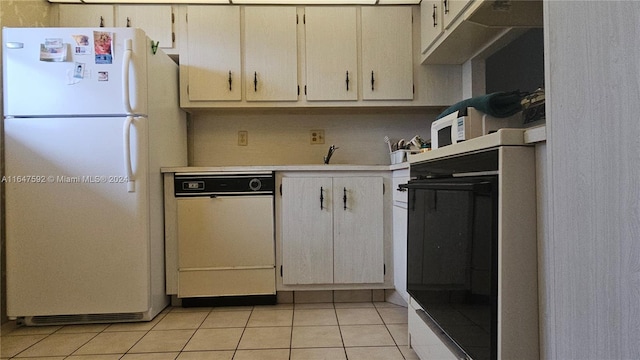 kitchen with white appliances and light tile patterned flooring