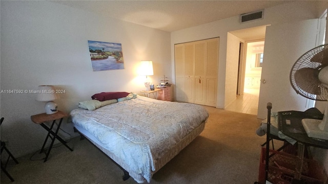 carpeted bedroom featuring a closet