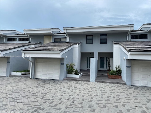 view of front of property with a garage