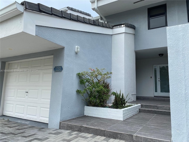 entrance to property featuring a garage