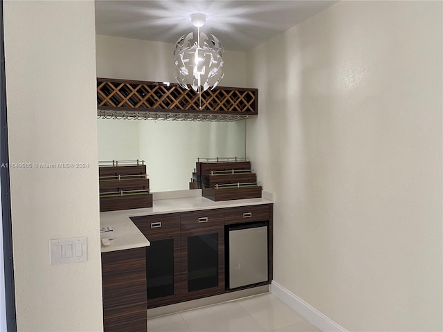 kitchen with decorative light fixtures, a chandelier, and light tile patterned floors