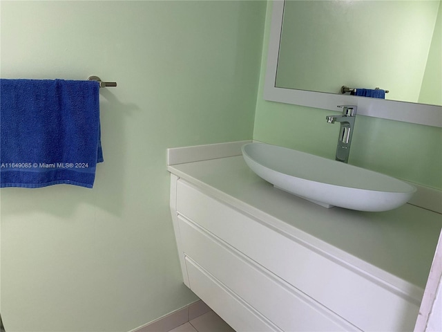 bathroom with tile patterned floors and vanity