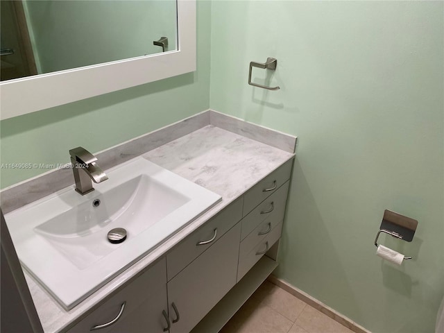 bathroom with tile patterned floors and vanity