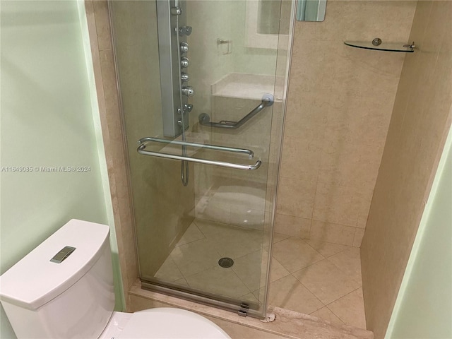 bathroom with walk in shower and toilet