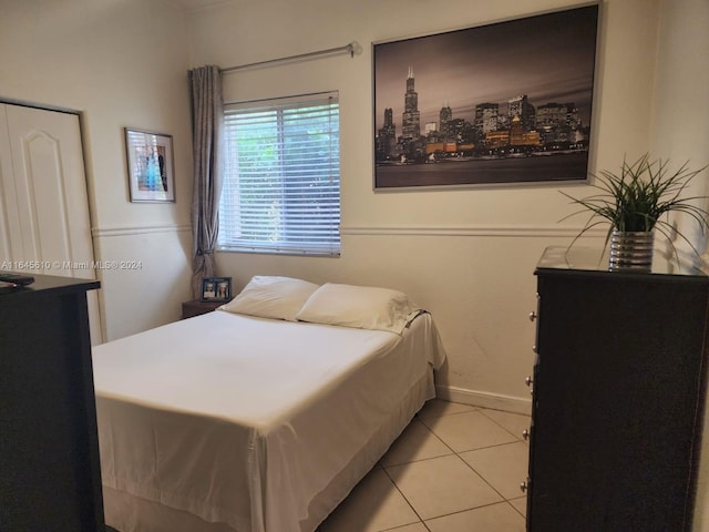 bedroom featuring light tile patterned floors