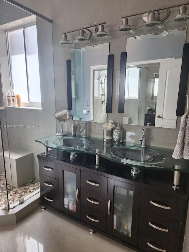 bathroom with vanity, tile patterned flooring, and plenty of natural light