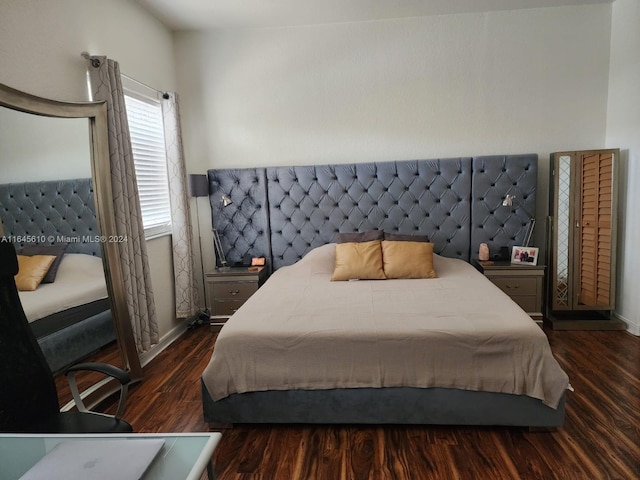 bedroom featuring dark wood-type flooring