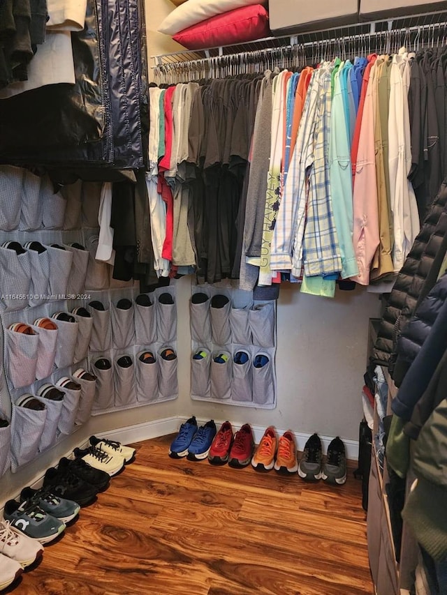 walk in closet featuring wood-type flooring