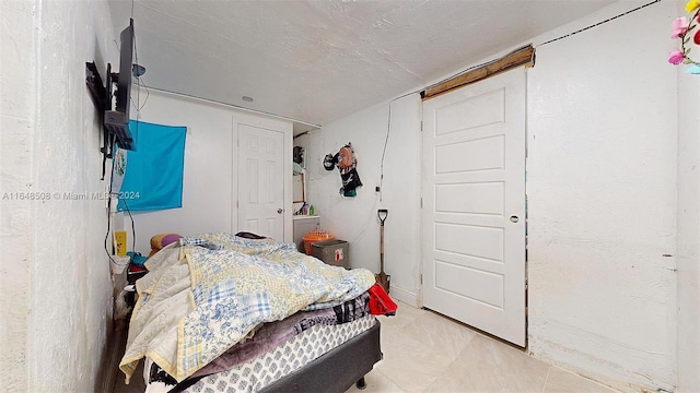 bedroom featuring a textured ceiling