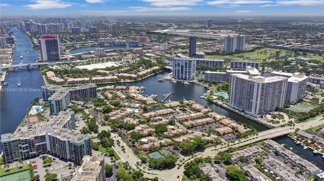 drone / aerial view featuring a view of city and a water view