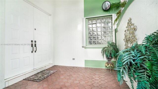 foyer entrance with tile patterned flooring