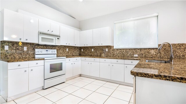 kitchen with white cabinetry, white appliances, backsplash, and sink