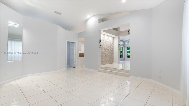 unfurnished room featuring light tile patterned floors