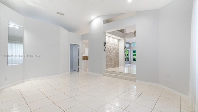 spare room featuring visible vents, baseboards, and light tile patterned floors