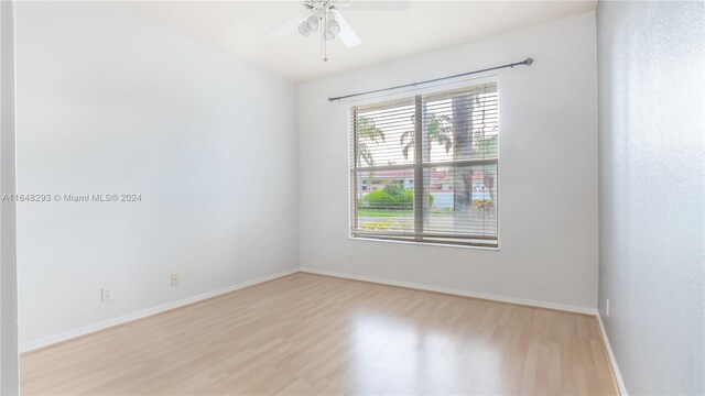 spare room featuring ceiling fan and light wood-type flooring