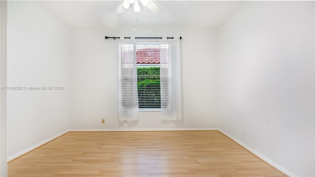 unfurnished room featuring ceiling fan and light hardwood / wood-style floors