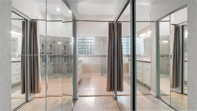 full bath featuring wood finished floors and vanity