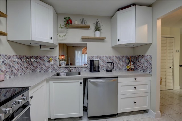 kitchen with dishwasher, white cabinetry, sink, and black electric range