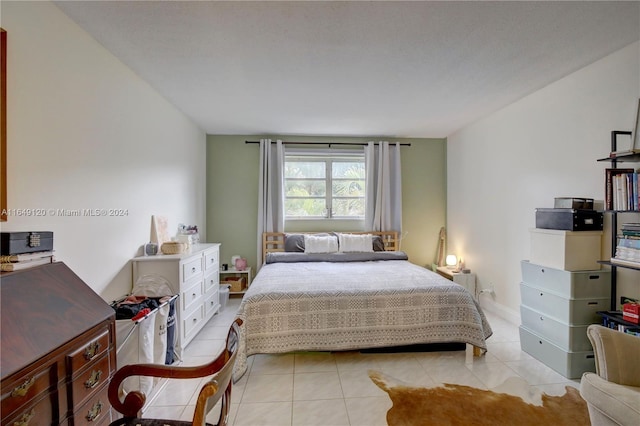 bedroom featuring light tile patterned floors