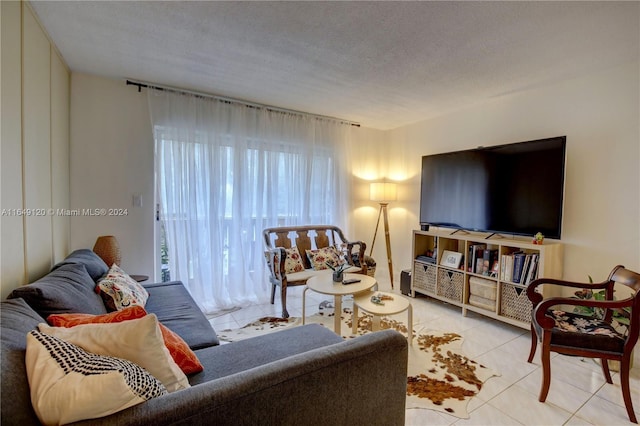 tiled living room with a textured ceiling