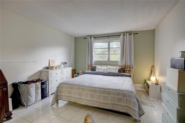 bedroom featuring light tile patterned flooring