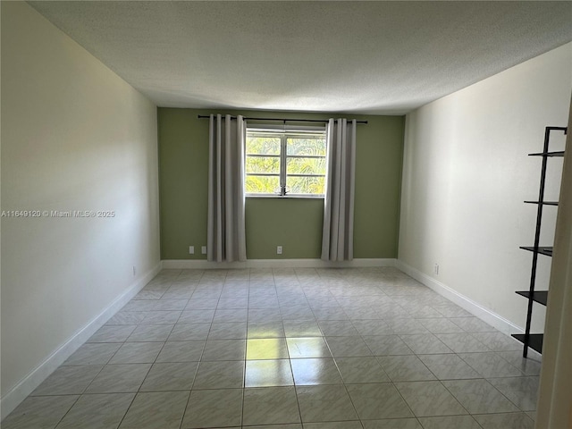 233 NE 14th Ave Unit 304, Hallandale Beach, FL 33009 - unfurnished room with a textured ceiling and baseboards
