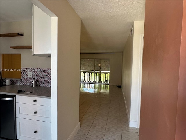 233 NE 14th Ave Unit 304, Hallandale Beach, FL 33009 - hall with baseboards and light tile patterned floors