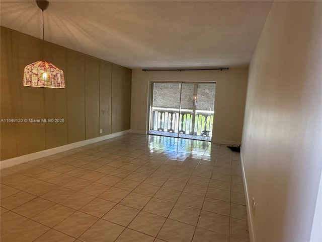 233 NE 14th Ave Unit 304, Hallandale Beach, FL 33009 - empty room with baseboards and light tile patterned flooring