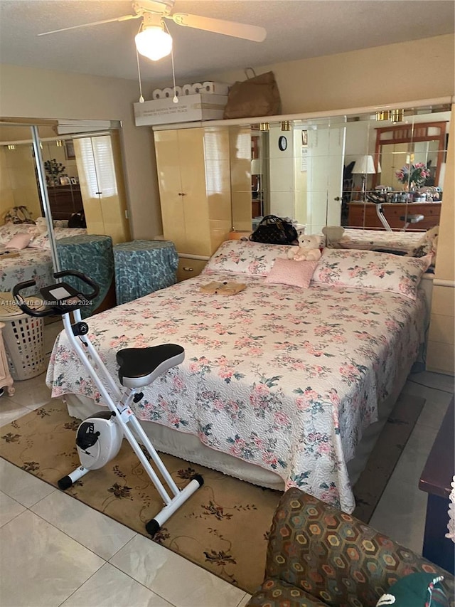 bedroom featuring tile patterned flooring and ceiling fan