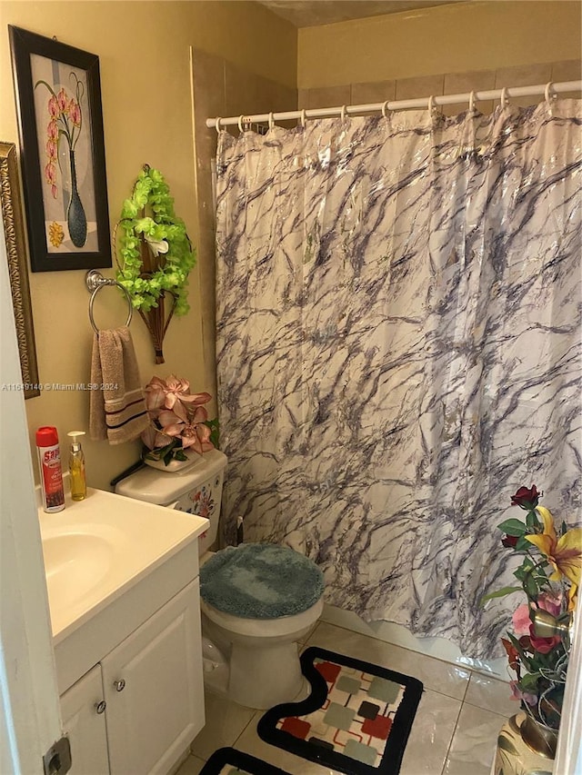 bathroom featuring vanity, tile patterned flooring, toilet, and a shower with curtain