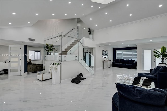 interior space with light tile patterned floors, high vaulted ceiling, and crown molding