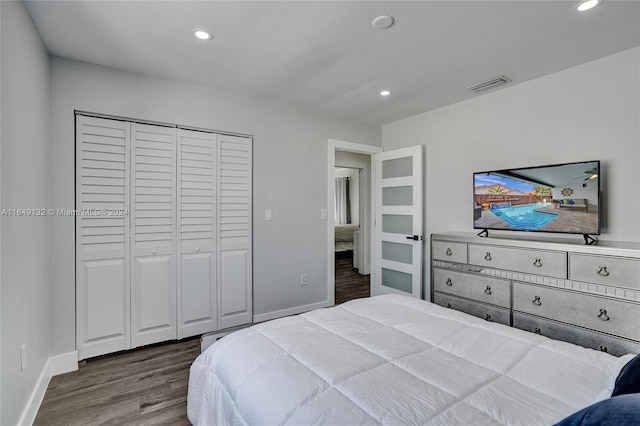 bedroom featuring hardwood / wood-style flooring and a closet