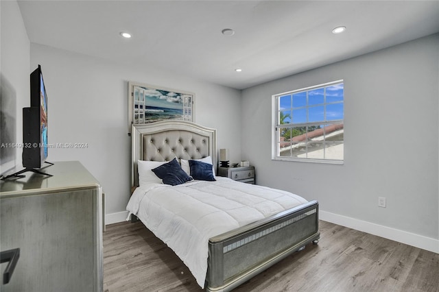 bedroom with light hardwood / wood-style floors