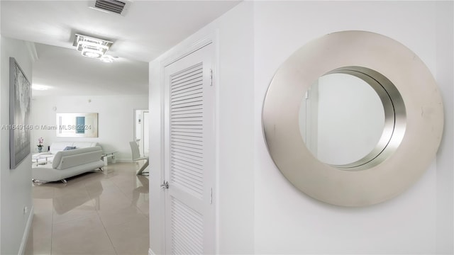 corridor featuring light tile patterned flooring