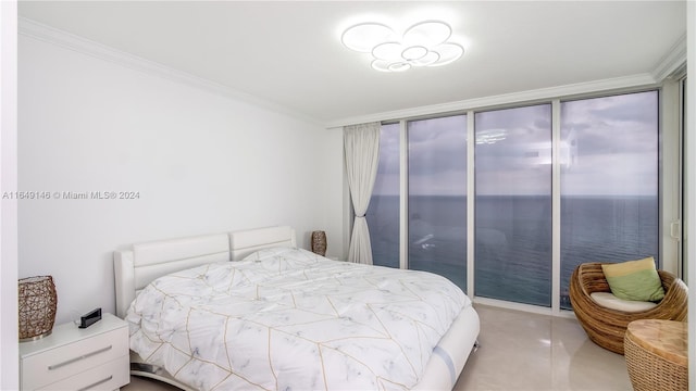 bedroom featuring ornamental molding, light tile patterned floors, and a water view