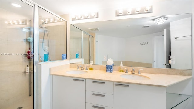 bathroom with vanity and walk in shower