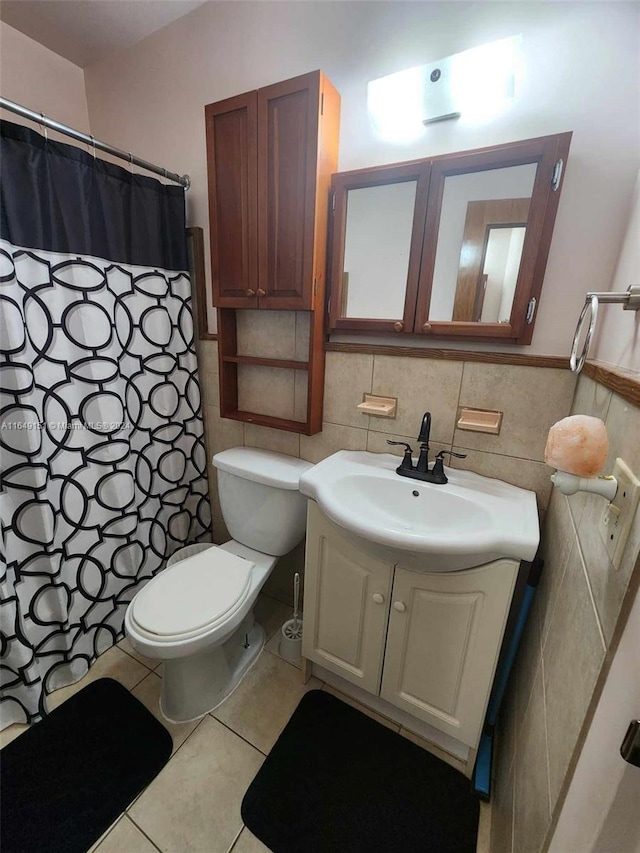 bathroom featuring vanity, tile walls, toilet, tile patterned floors, and decorative backsplash