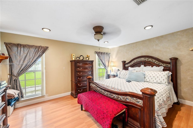 bedroom featuring ceiling fan and light hardwood / wood-style floors