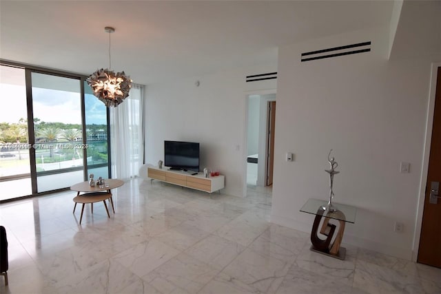 living room featuring a wall of windows and a chandelier