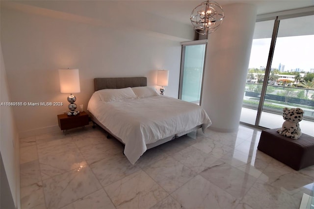 bedroom with access to outside, expansive windows, and a chandelier