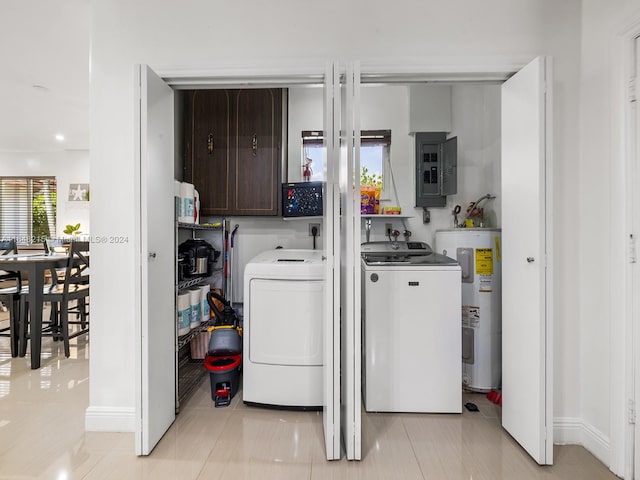 laundry area with water heater, light tile patterned floors, washer and clothes dryer, and electric panel