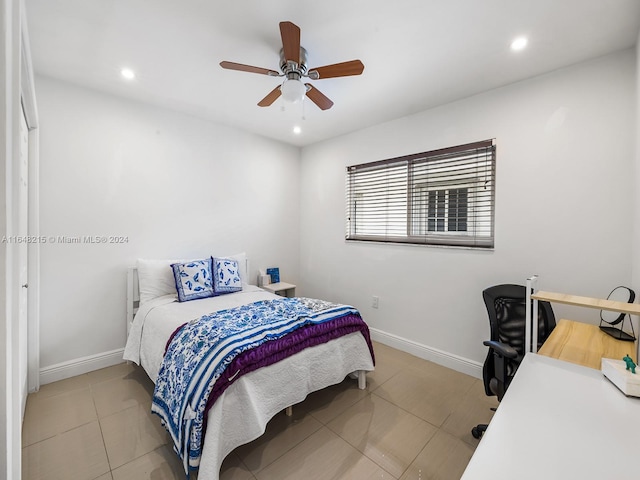 tiled bedroom with ceiling fan