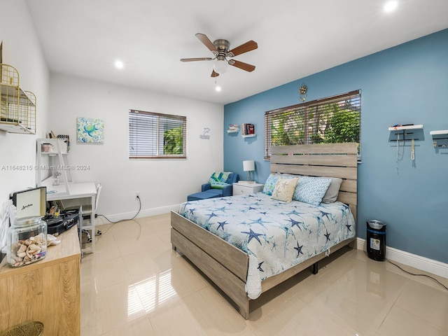 tiled bedroom featuring ceiling fan